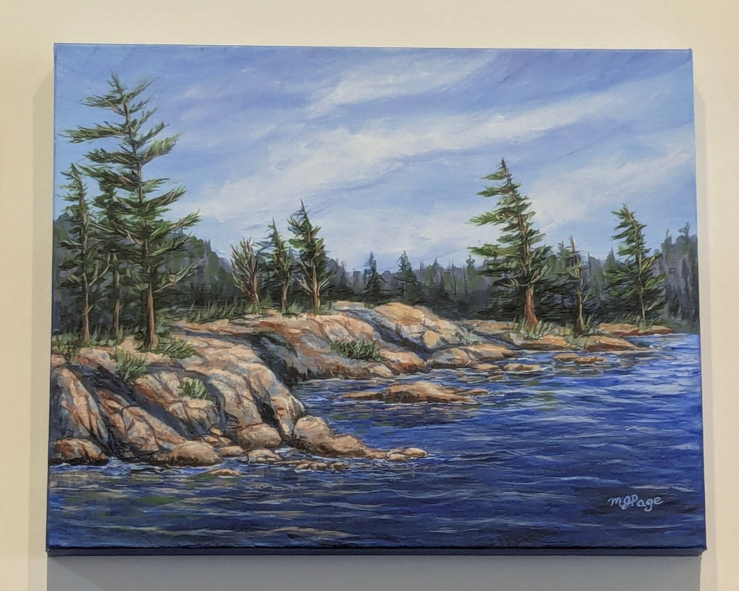 Painting of a serene lakeside scene with rocks and trees.