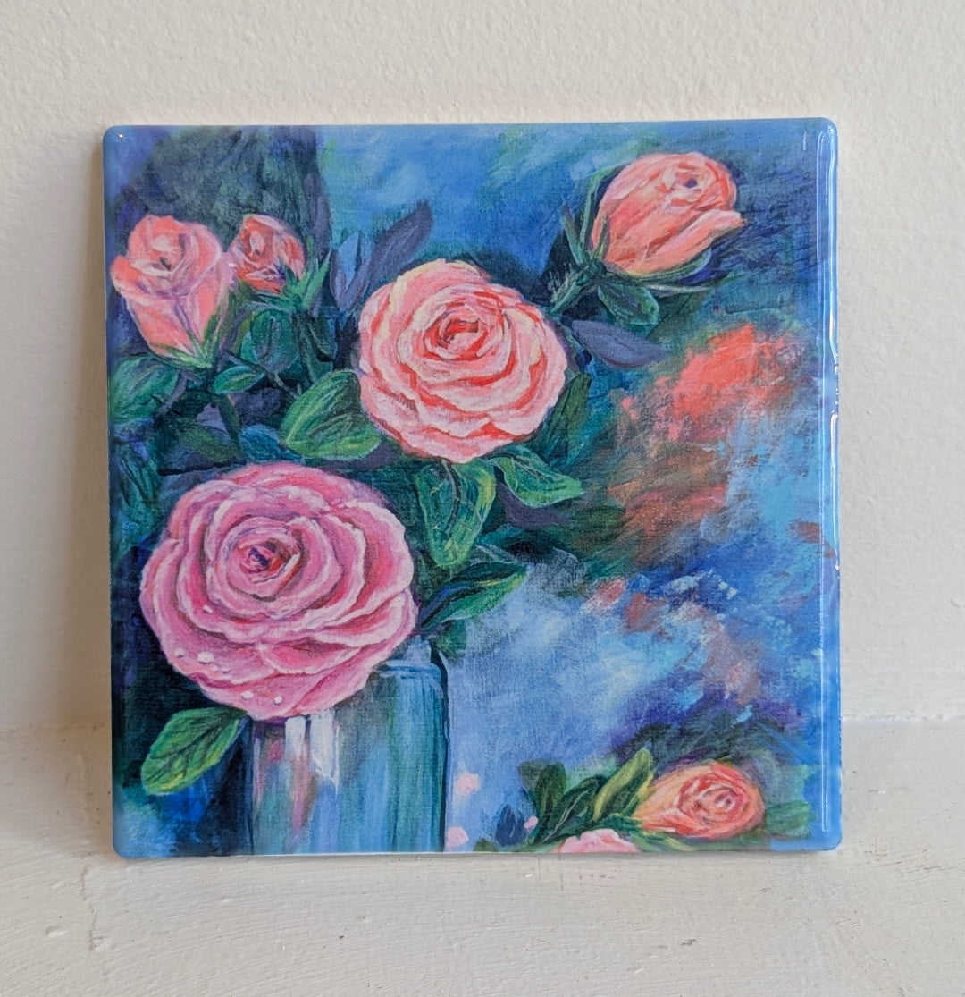 Painting of pink roses in a blue vase on a white background