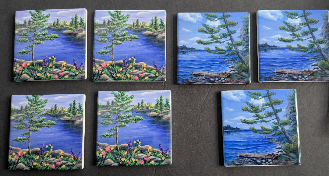small square tiles with lake and forest scenes on a dark background
