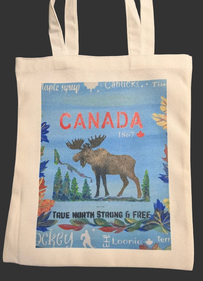 Tote bag with Canadian design featuring a moose and text on a blue background.