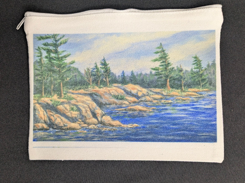 Pouch with a nature scene of trees and water on a black background