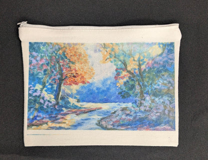 Canvas pouch with a colorful landscape design on a white background