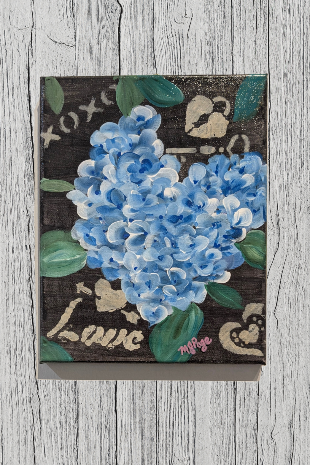 Decorative mat with blue flowers and decorative text on a back background