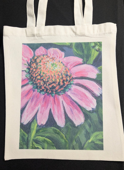 Tote bag with a pink flower design on a  green & dark purple background