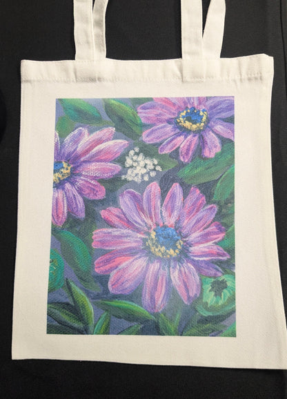 Tote bag with a floral design featuring purple flowers on a white background