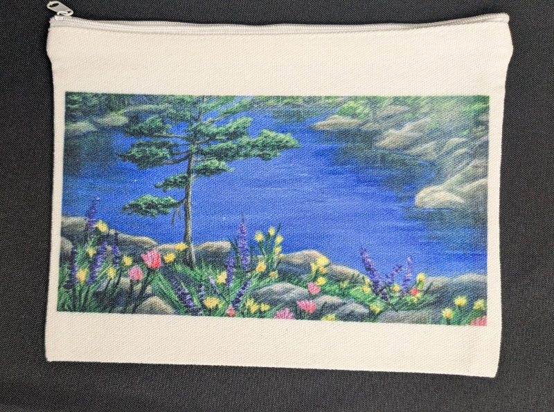 Canvas pouch with a nature scene of trees and flowers on a black background