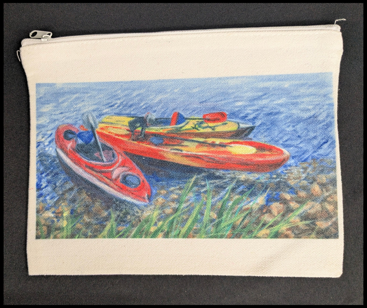 Pouch with a painting of three kayaks on water, on a black background