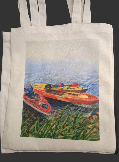 White tote bag with a printed design of three kayaks on water.